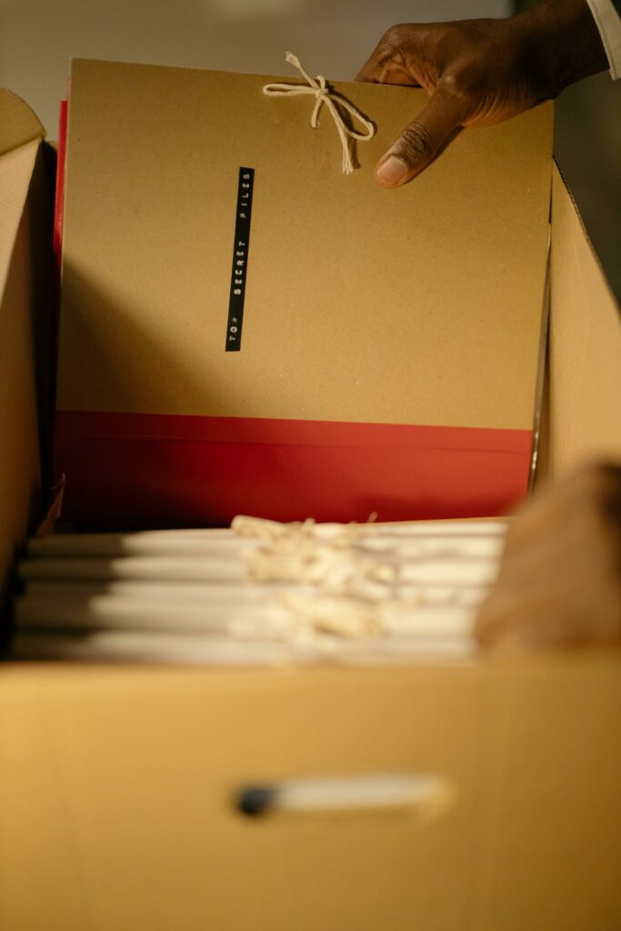 Close-Up Shot of a Person Holding Files